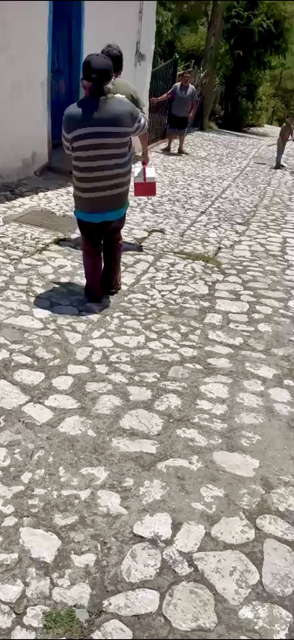Alfredo walking along a steep stone street